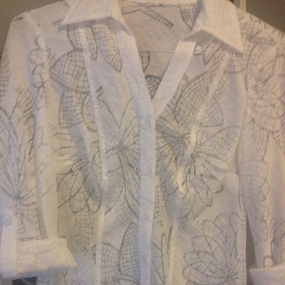 White shirt with patterned sheer print.