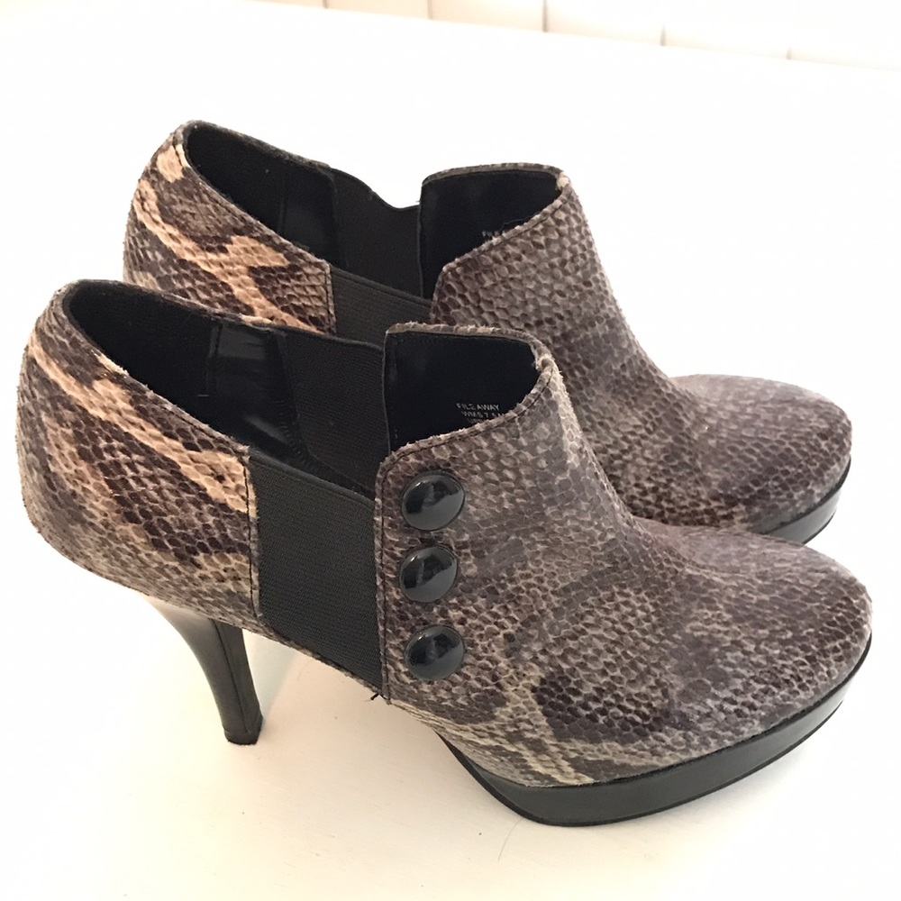 Like new snake skin patterned heeled booties
