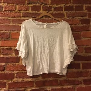 Crop top with lace detailing and button down back!