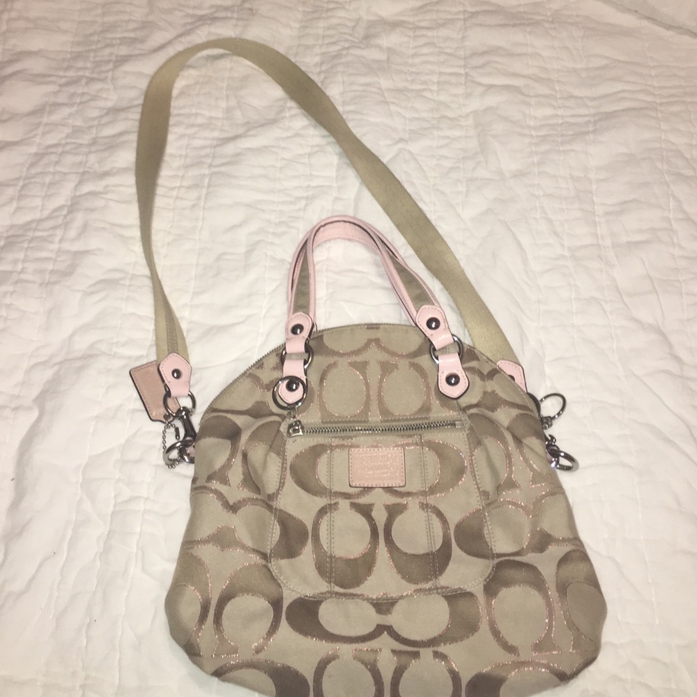 Coach Poppy tan foldover with light pink details.