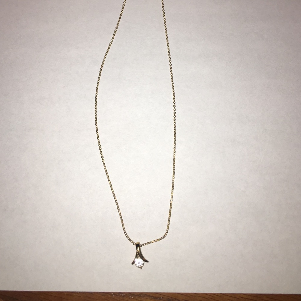 Gold chain necklace with jewel