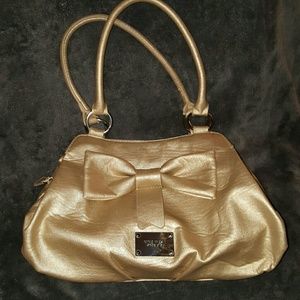 Metallic gold Nine West purse with large bow