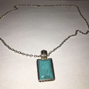 silver chain necklace with green stone pendant