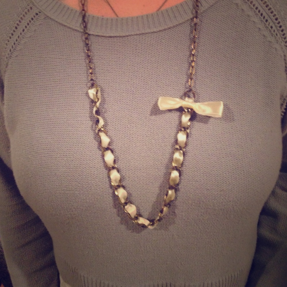 White ribbon and distressed gold necklace
