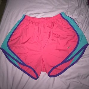 Dark pink Nike tempo shorts