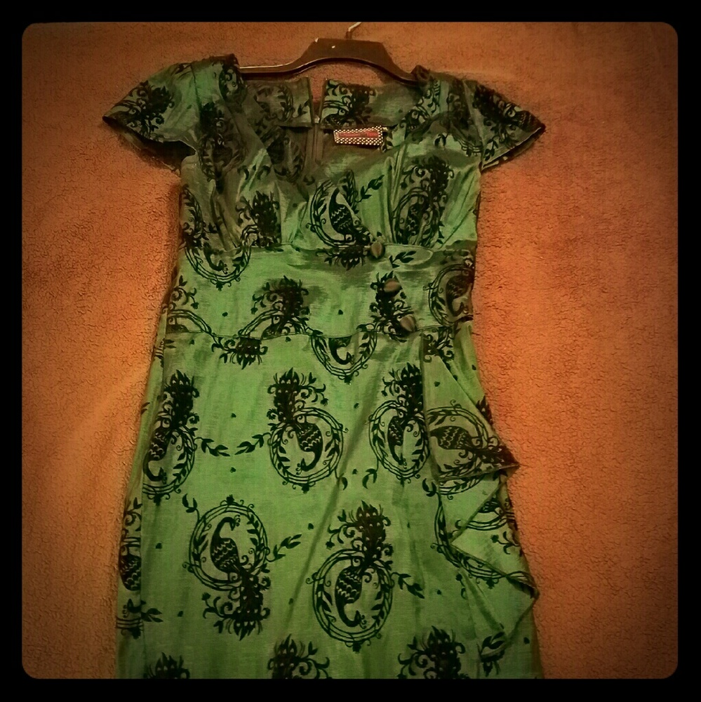 Emerald green dress with velvet bird detail