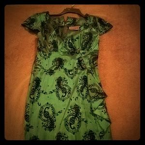 Emerald green dress with velvet bird detail