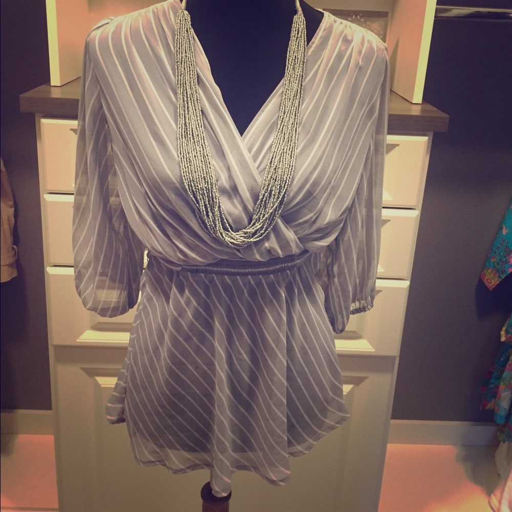 Sheer wrap top. Grey and white pinstripes.