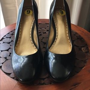 Patent leather Coach pumps
