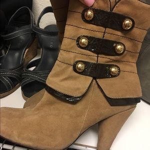 Brown boots with golden buttons