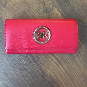 Red Michael Kors wallet.