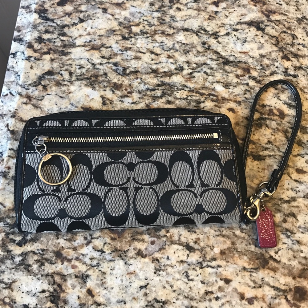 Classic coach wristlet in black with pink accent