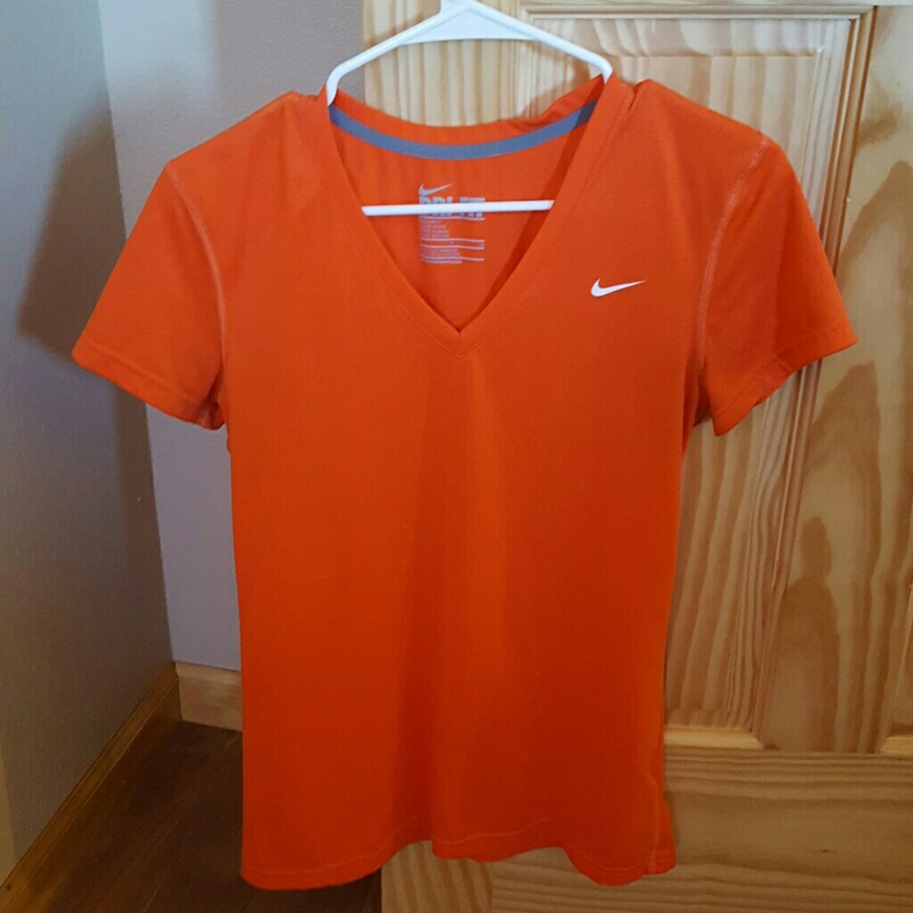 Orange nike dri-fit shirt.