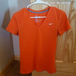 Orange nike dri-fit shirt.