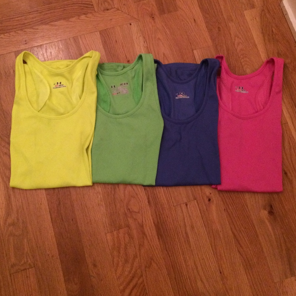 Lot of four Under Armour athletic tanks size S