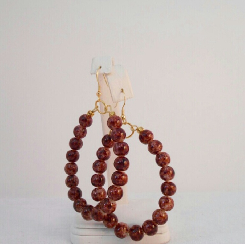 Brown glass beads with gold - plated spacers