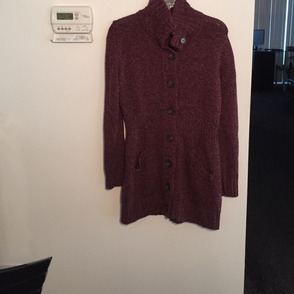 Purple sweater. Buttons all the way down.