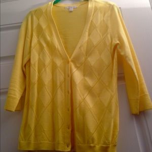 Three quarter length sleeve bright yellow sweater.