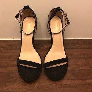 Good condition. Black single strap heel.