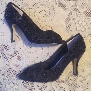 Gorgeous black heels embellished with beads.