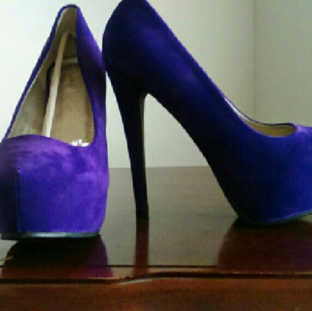 Purple platform pumps.   DONATED