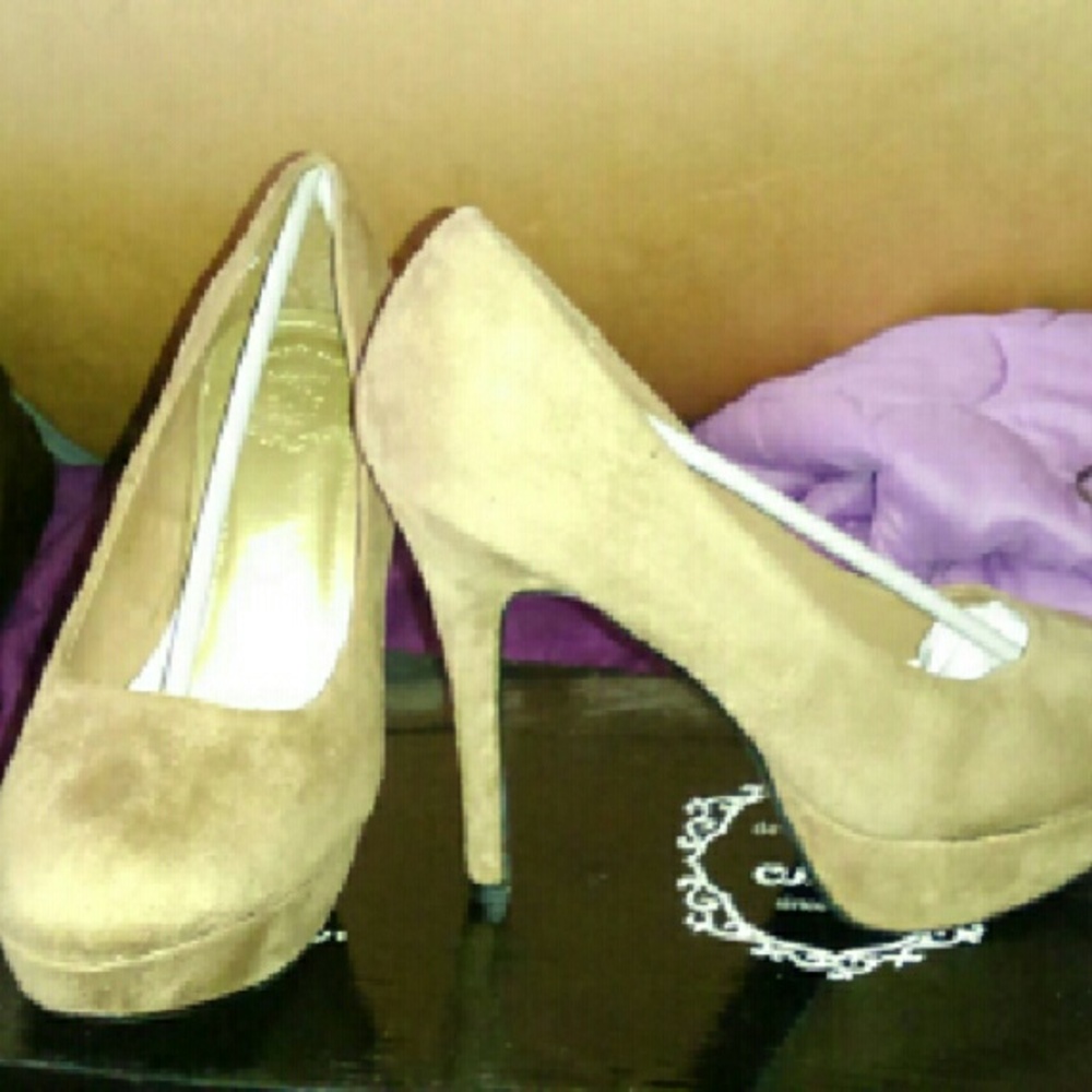 Beige high heel pumps.  DONATED