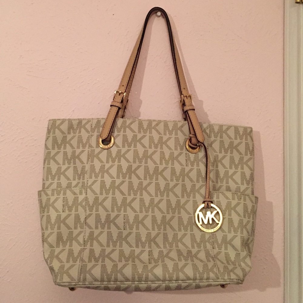 White and gray Michael Kors jet set travel bag