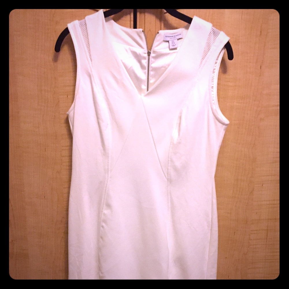 Form fitting off white dress.