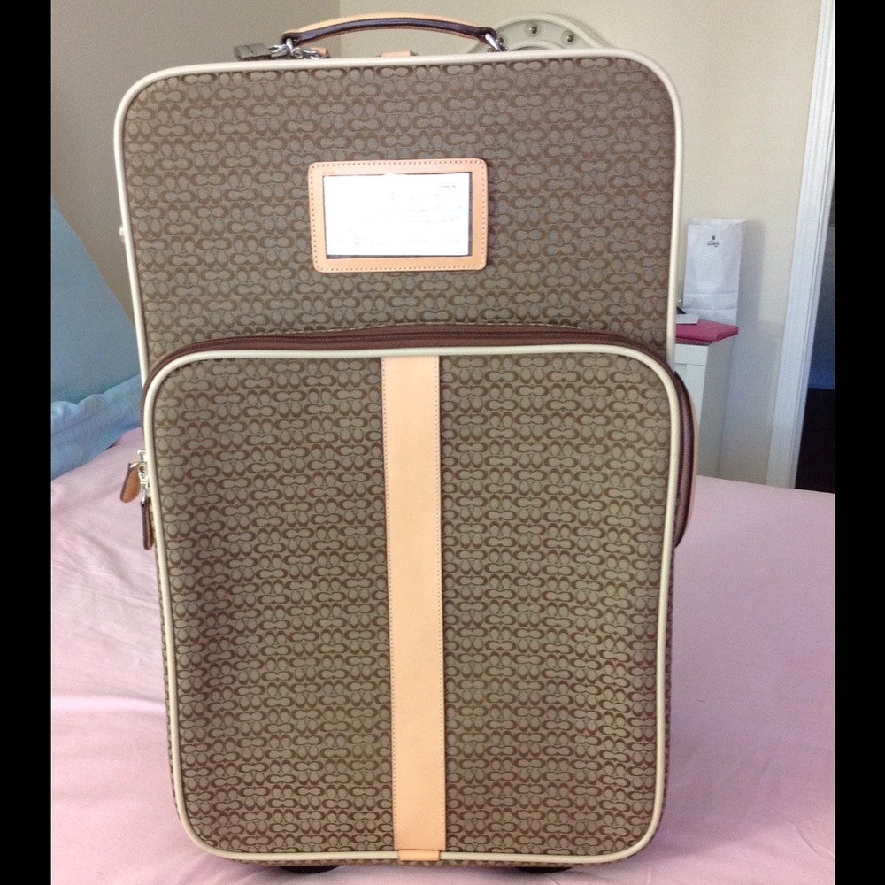 Genuine Coach Signature CC Logo carry on suitcase.