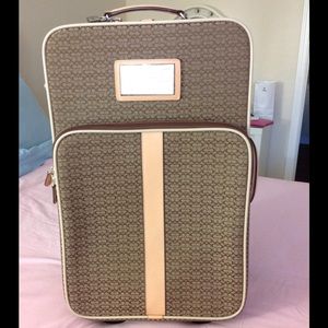 Genuine Coach Signature CC Logo carry on suitcase.