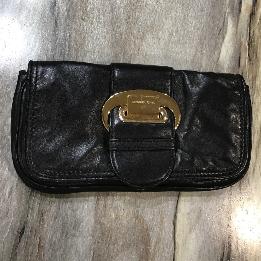 Micheal Kors black leather clutch with gold buckle