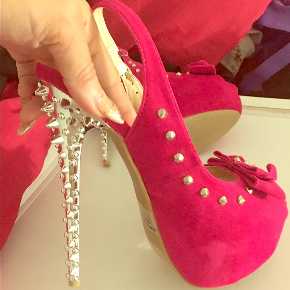 Pink platform spiked heels