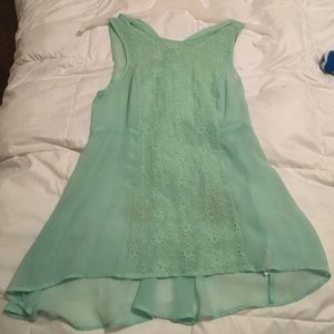 Mint green sleeveless top.