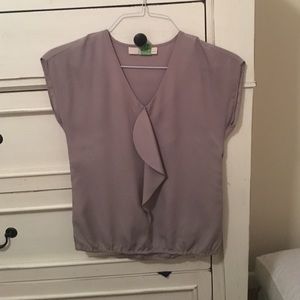 Taupe ruffle front blouse.