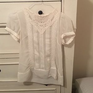 White lace button-back sheer top.