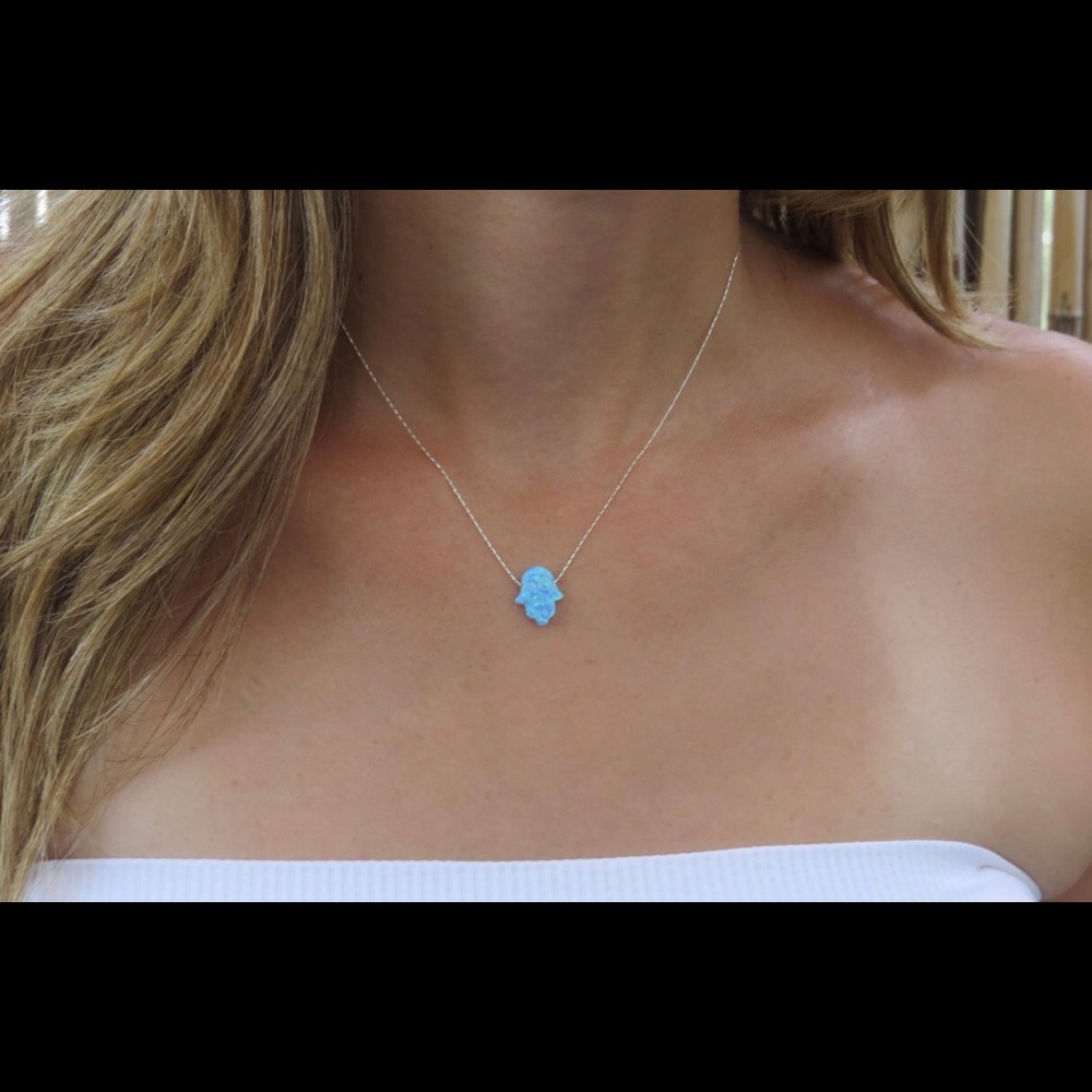Turquoise hamsa necklace.
