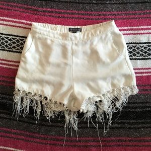 White fringe shorts