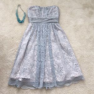 Silver lace strapless BCBG Maxazria dress.