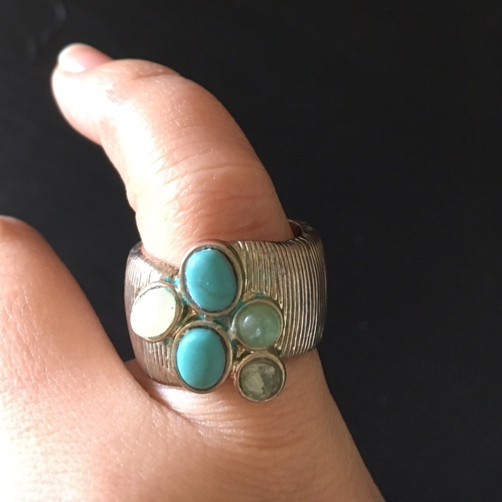 Gold ring with turquoise and jade stones.