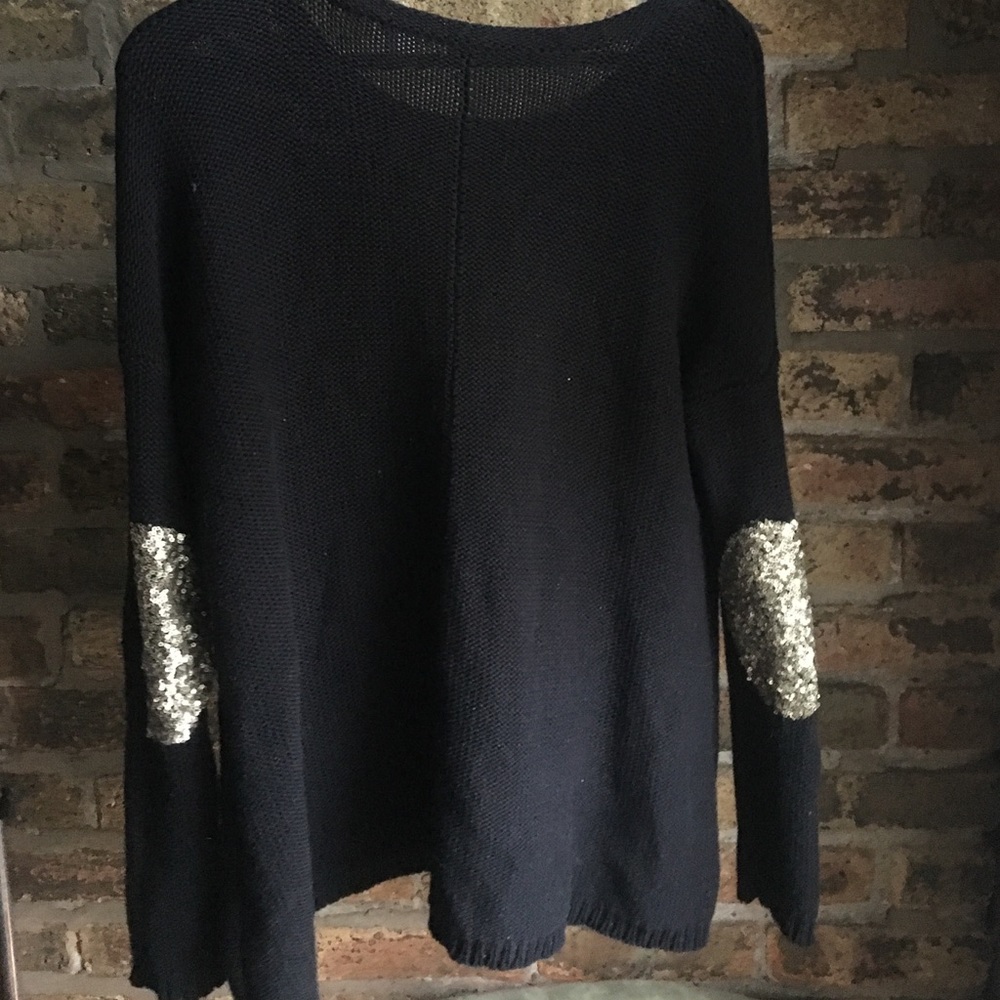 Black sweater with gold sequin elbow patches