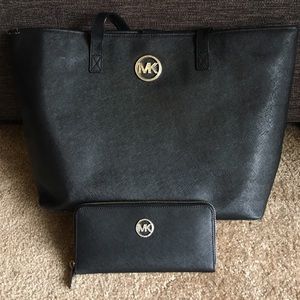Used black Michael Kors tote with matching wallet!