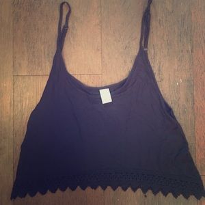 Black cropped tank top with lace detailing on hem