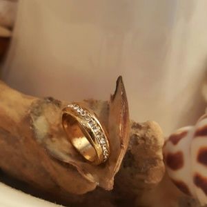 Gold stainless steel eternity band with sparkling