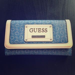 Brand new never been used Guess tri-fold wallet