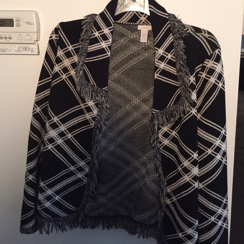 Black and white jacket with fringe all around.