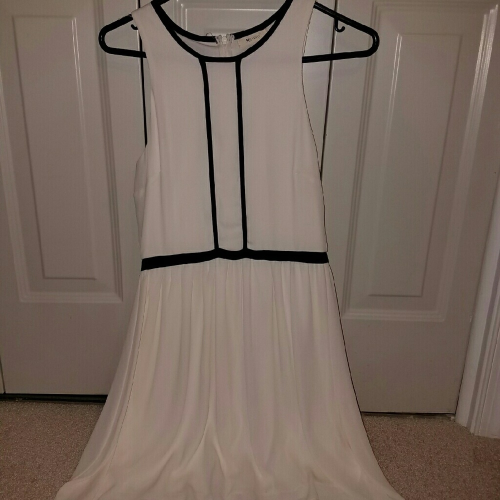 Francesca's white dress with black trim