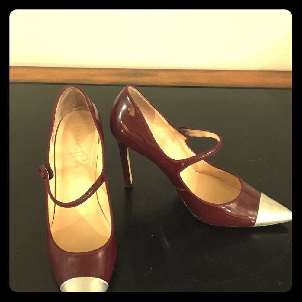 Silver cap-toed stilettos.