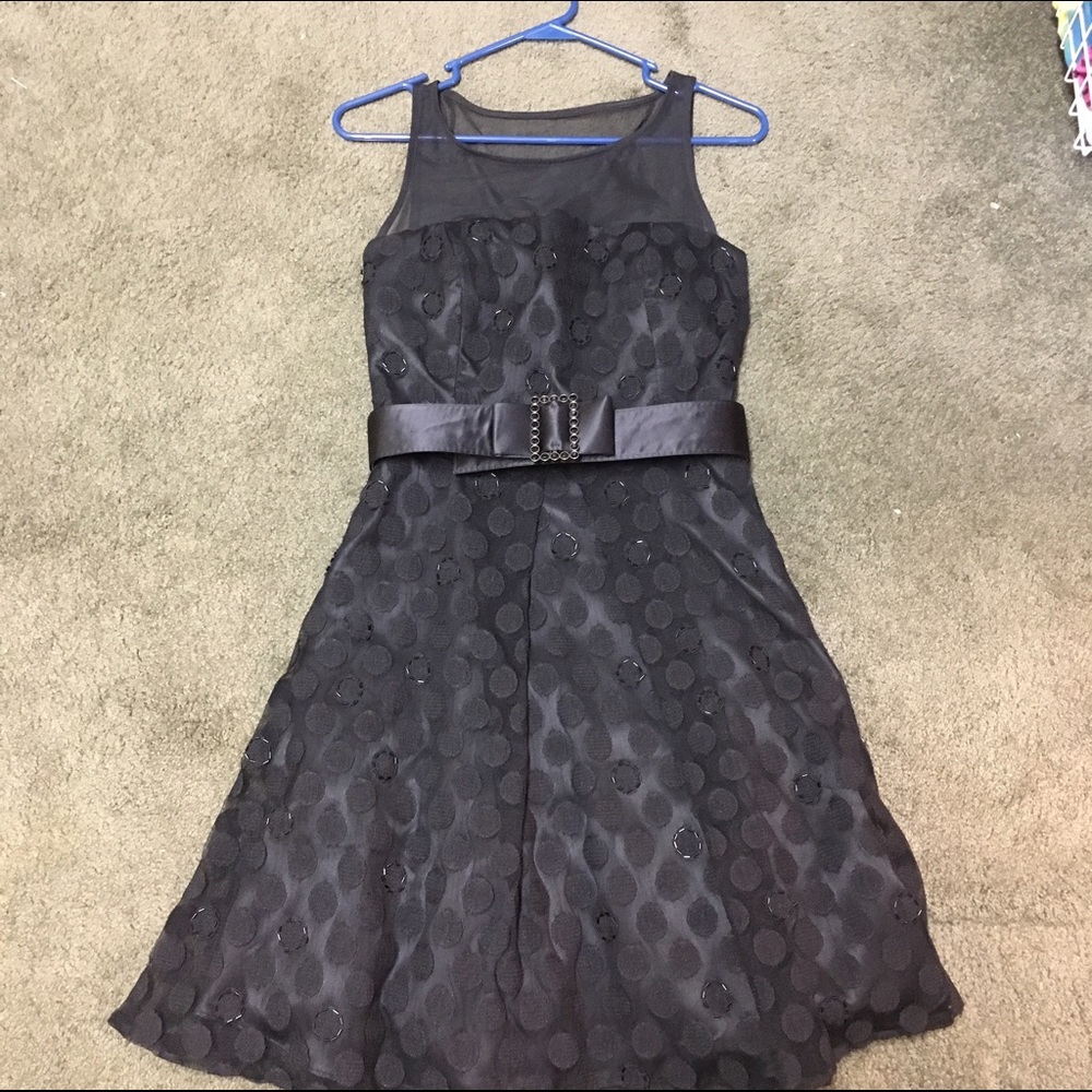 Black cocktail dress with beaded detail and belt