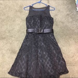 Black cocktail dress with beaded detail and belt