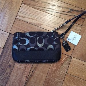 Authentic Coach wristlet in black and silver